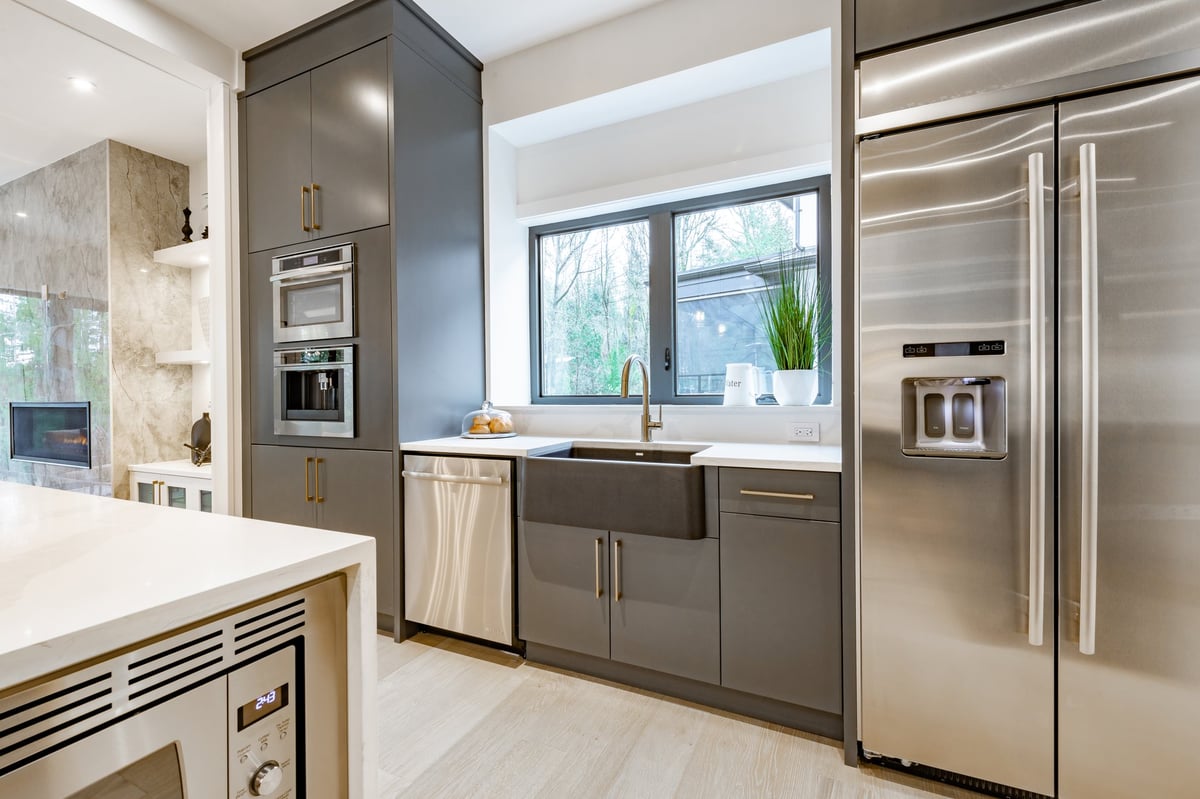 Large spacious kitchen with gleaming stainless steel appliances freshly cleaned